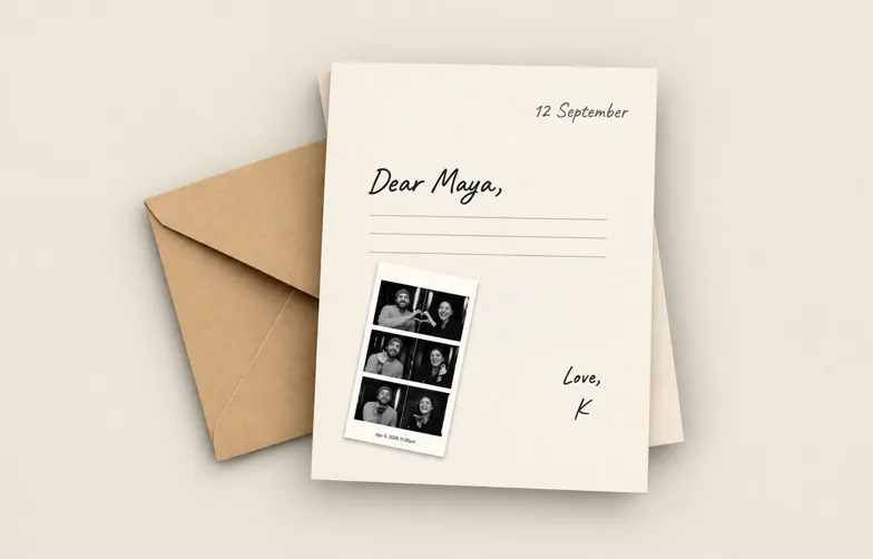 A handwritten letter with a photo strip, beside its envelope